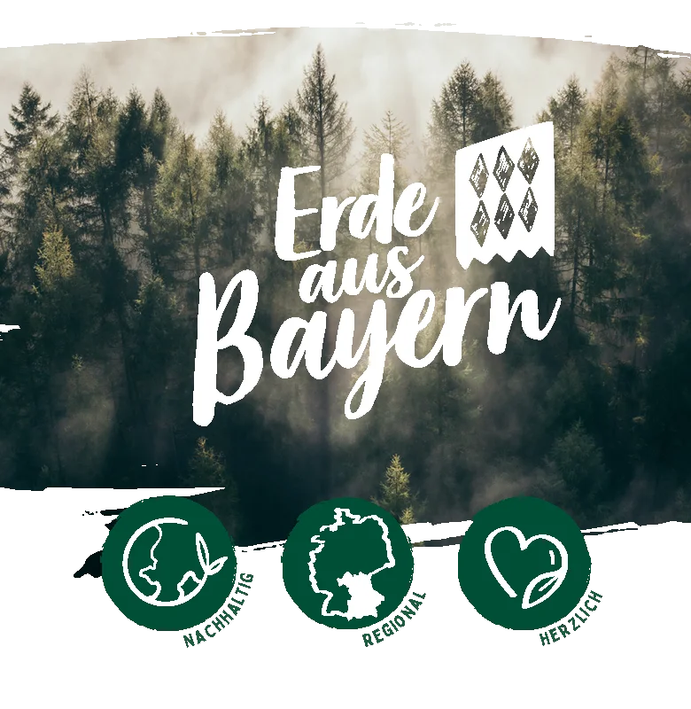 Schriftzug Erde aus Bayern vor Wald